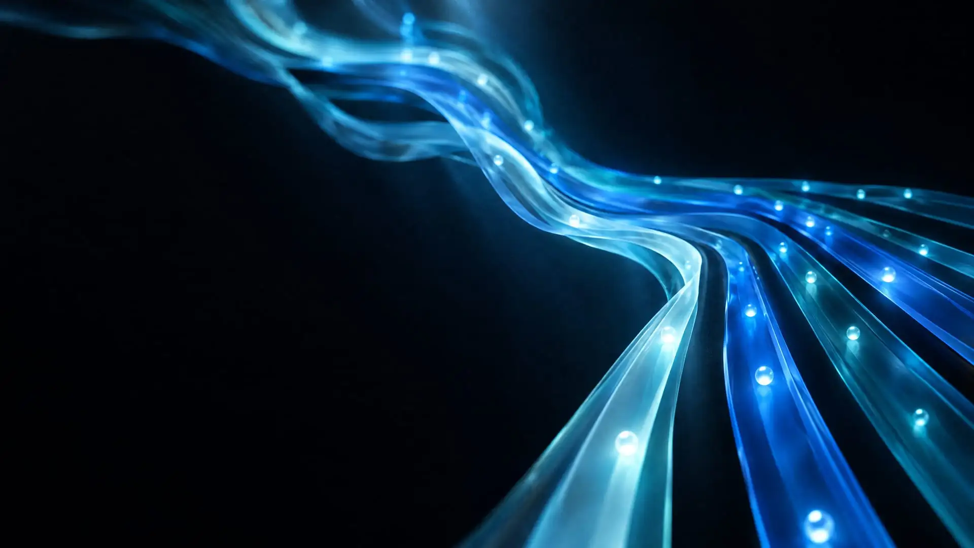 Imagem abstrata em fundo escuro, com fitas de vidro translúcido em azul-gelo, azul-céu e azul-oceano que convergem em faixas paralelas e ordenadas, sem texto.